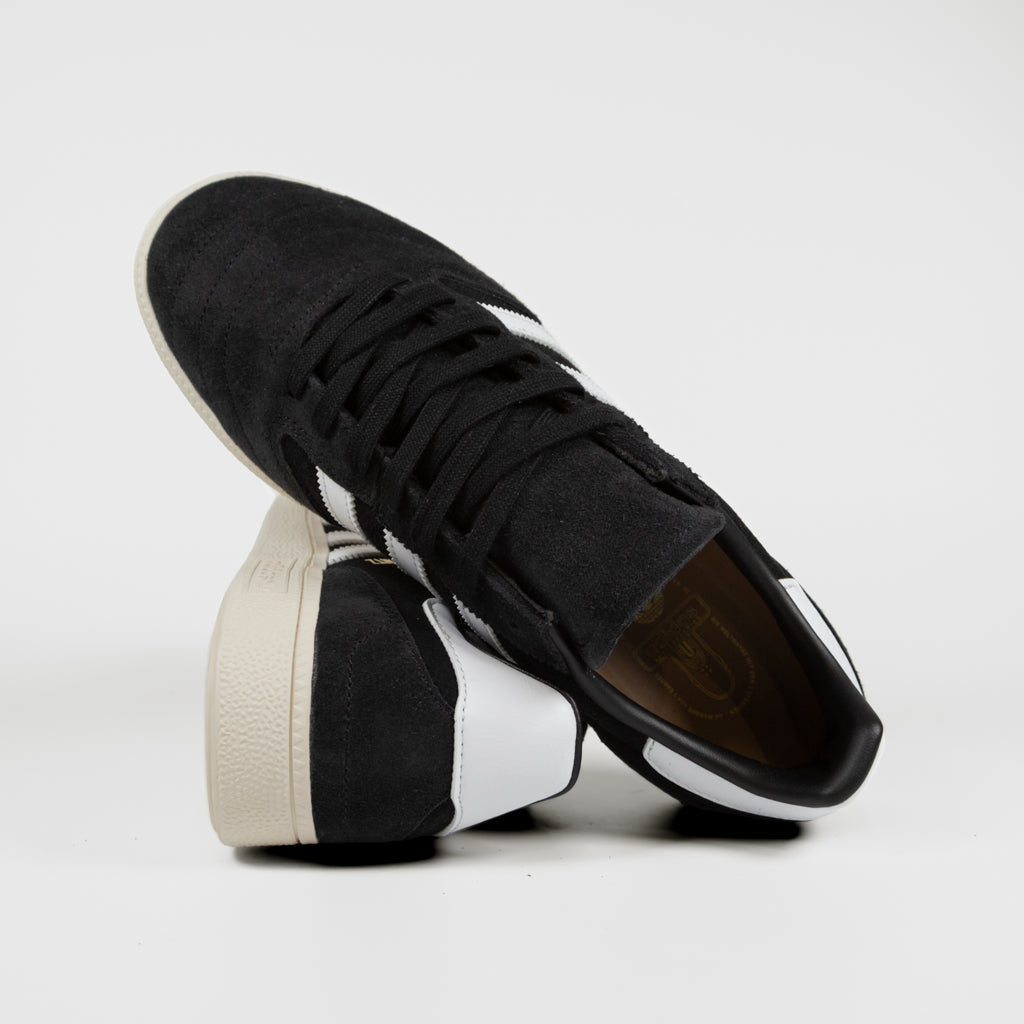 Black and white suede adidas trainers 2025