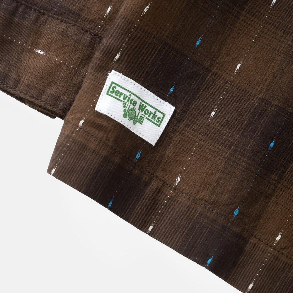 Tab Detail Of Brown Service Works Drag Stitch Resort Long Sleeve Shirt