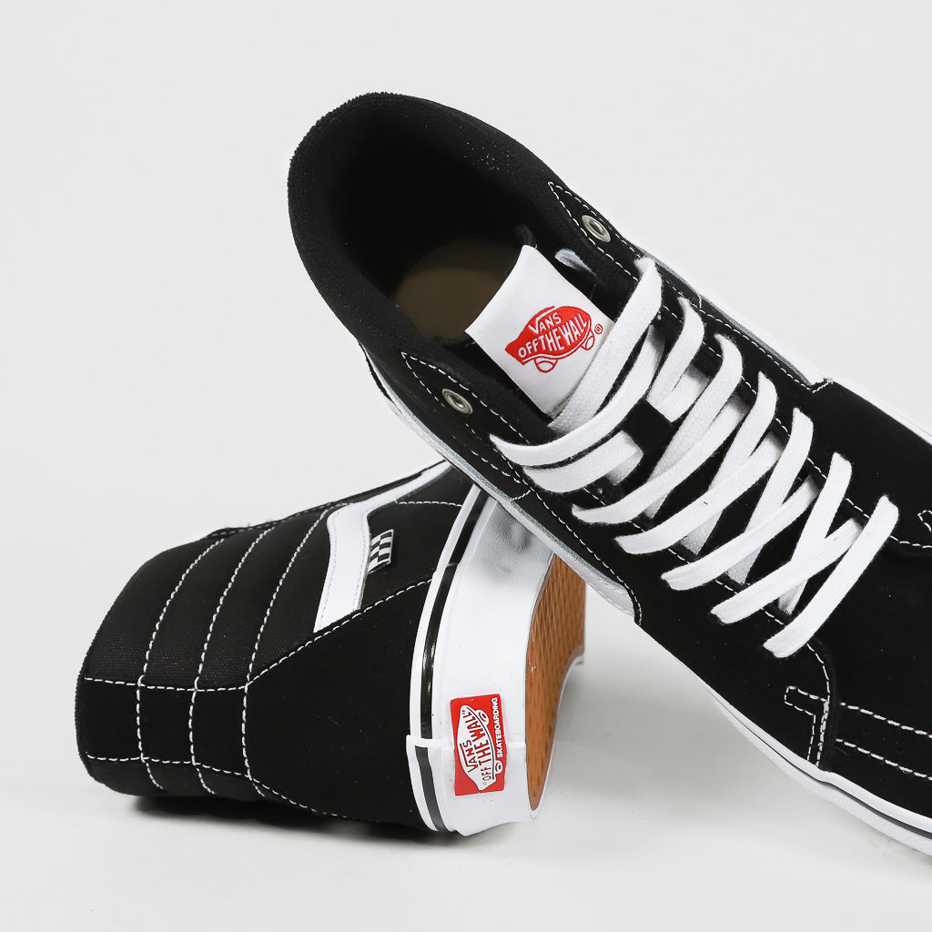 Vans black and white hotsell skate shoes